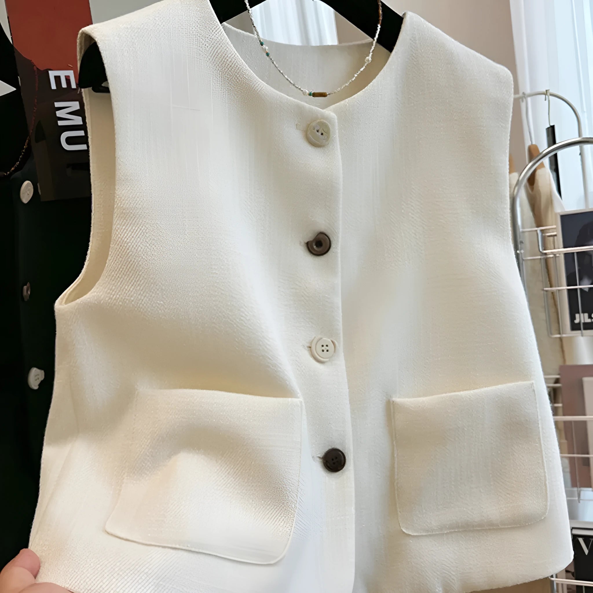 Women's French style round neck bandage vest in polyester fabric, available in milky white and black colours