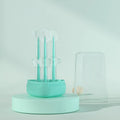 Blue, green, and purple pet toothbrushes with soft silicone bristle heads for dogs and cats.
