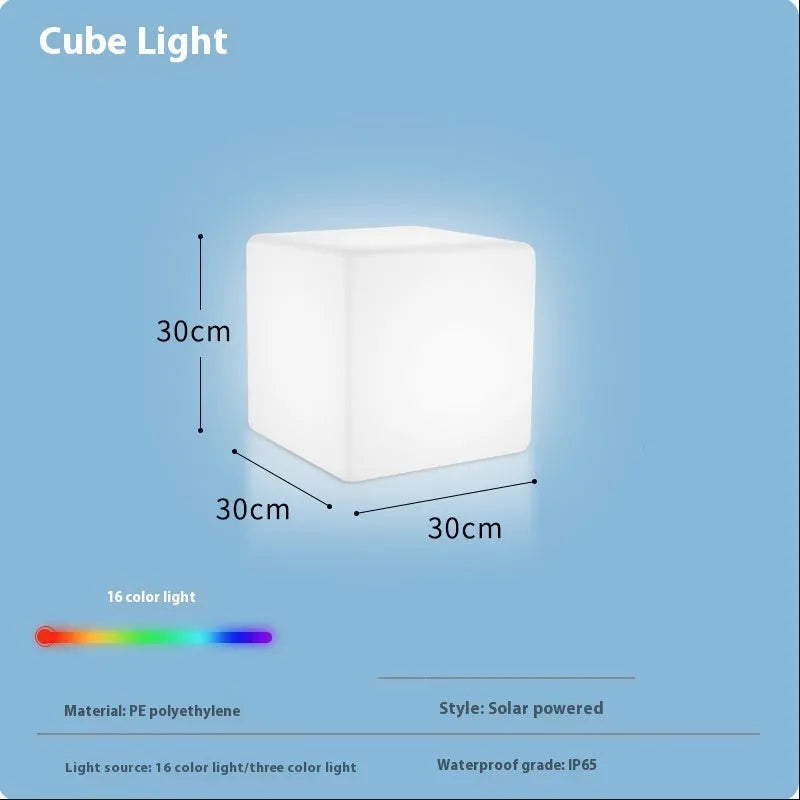 Modern square LED cube light stool in a garden setting, showcasing its clean design and luminous top.