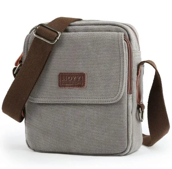 Canvas shoulder bag in khaki with polyester lining, small size 20x7x23cm, shown as a structured day bag