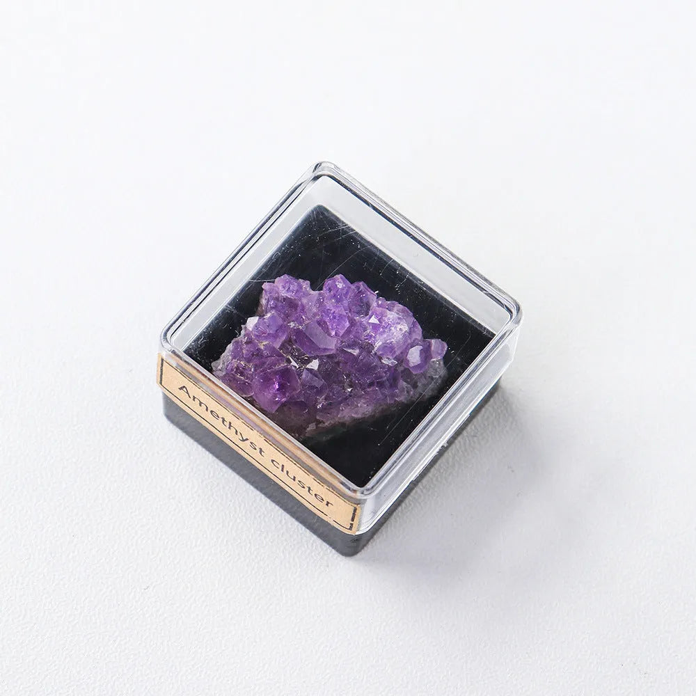 Geometric natural amethyst crystal ore mineral specimen decoration on a wooden surface.