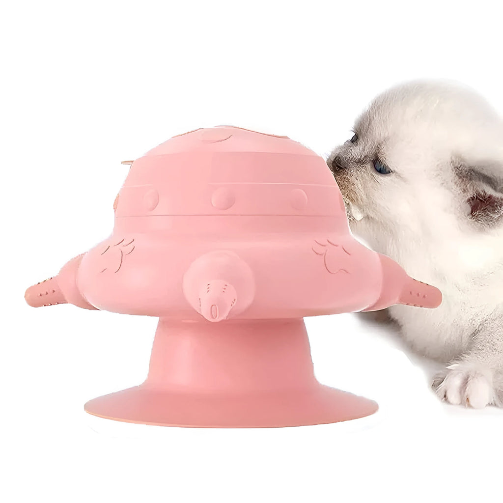 Pink silicone pet nursing device with pacifiers for feeding puppies and kittens.