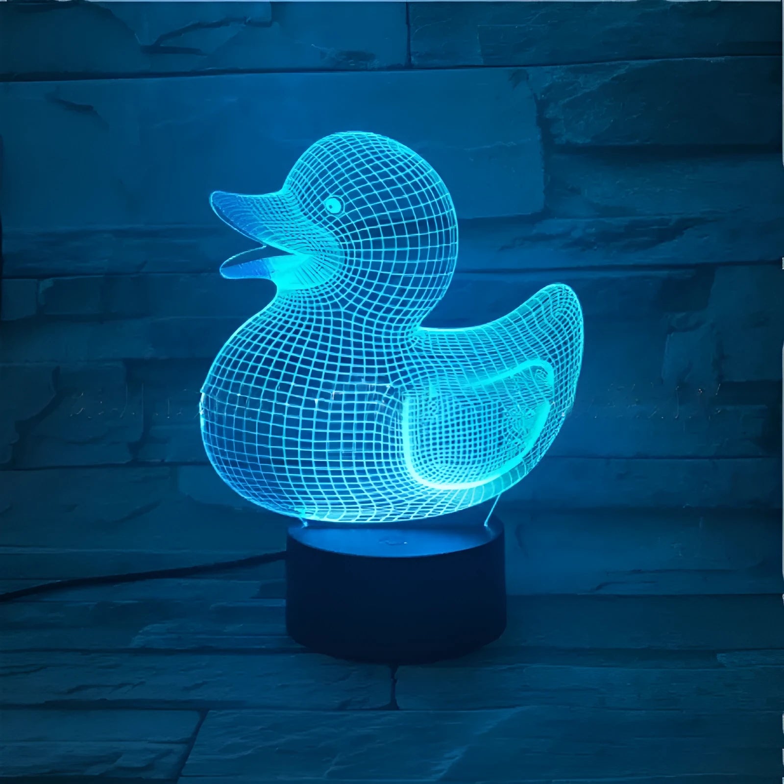 Yellow duck-shaped 3D acrylic night light with ABS base, showing multi-colour LED glow.