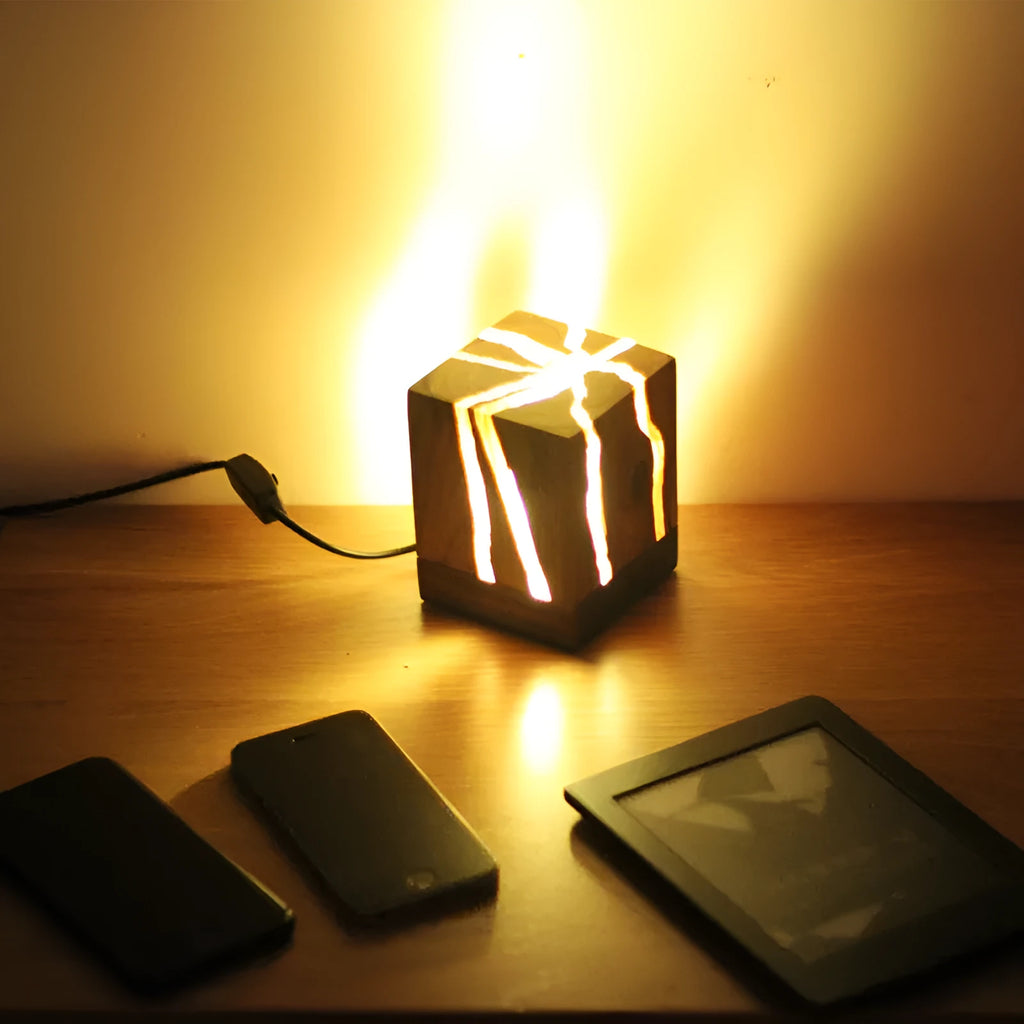 Creative crack night lamp in wood and PMMA with USB cable on bedside table