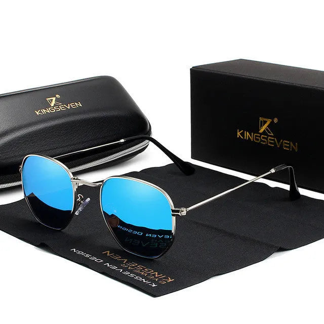 Classic round retro sunglasses for men in gun grey finish with UV400 lenses on a wooden table.