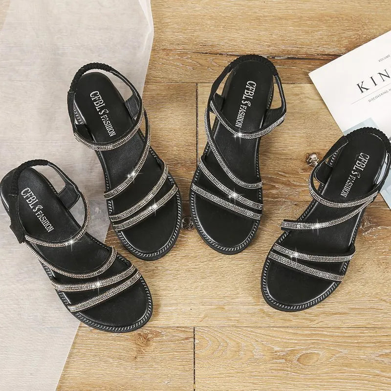 Women's silver Korean-style flat sandals with rhinestone elastic strap and round toe.