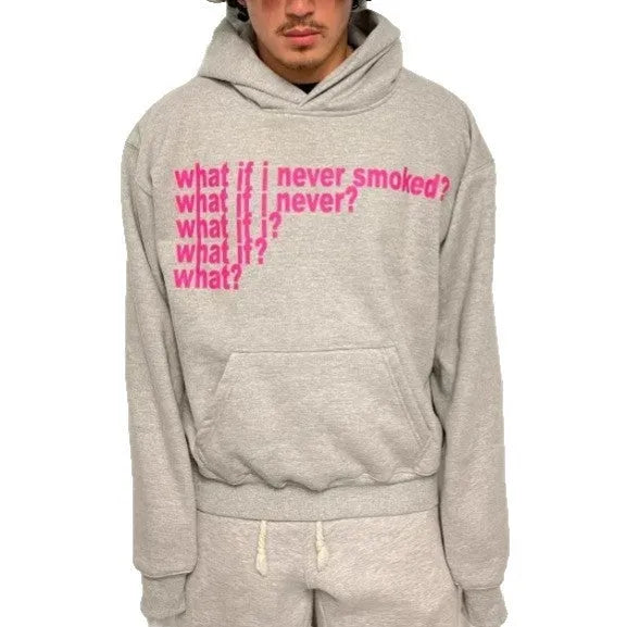 Black and grey heavy hooded sweater with printed letter graphics, showing front view with hood up