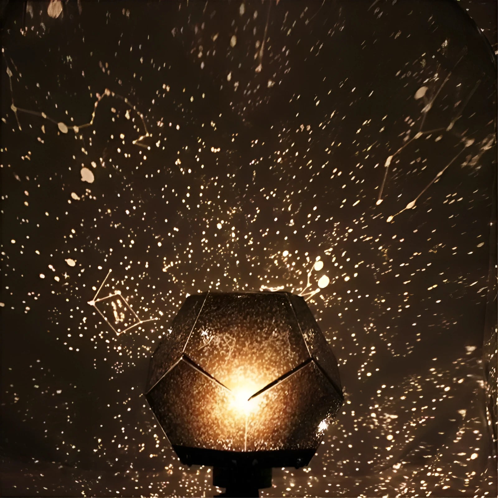 LED starry sky projector night lamp showing constellation projections on a bedroom ceiling with remote control