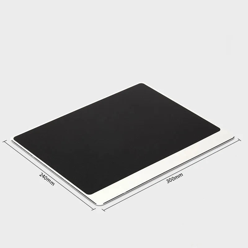 Metal alloy desk mat mouse pad in silver, large size, on a wooden desk