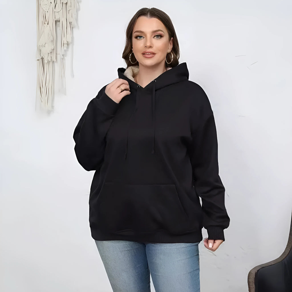 Women's loose hooded sweater with pockets in black colour showing 3D pattern detail