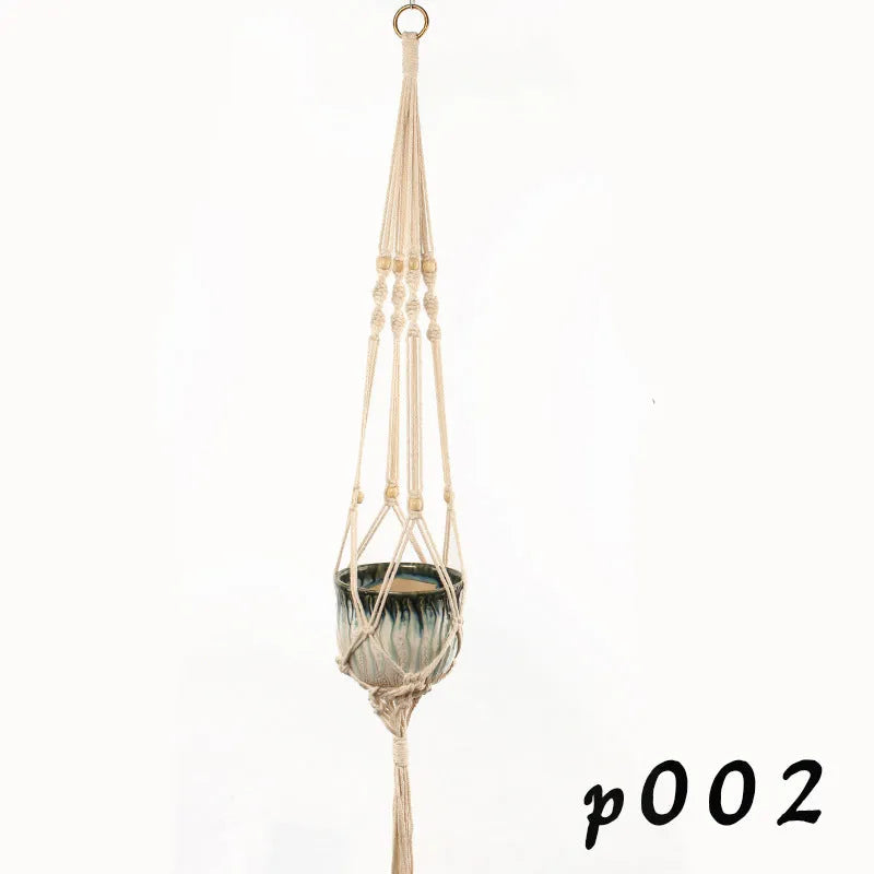 A rustic-style woven cotton rope plant trellis panel supporting green leaves.