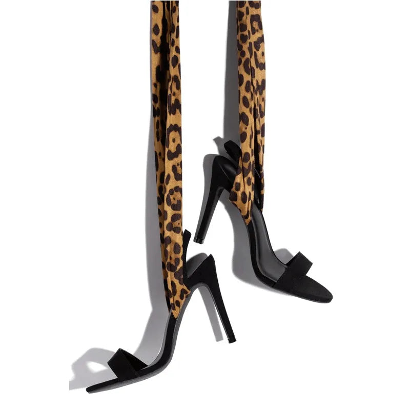 Light brown women's leopard print high heel sandals with cross-straps and a thin 8cm heel.