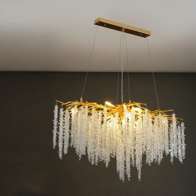 Modern crystal and aluminium alloy LED chandelier light fixture with adjustable height.
