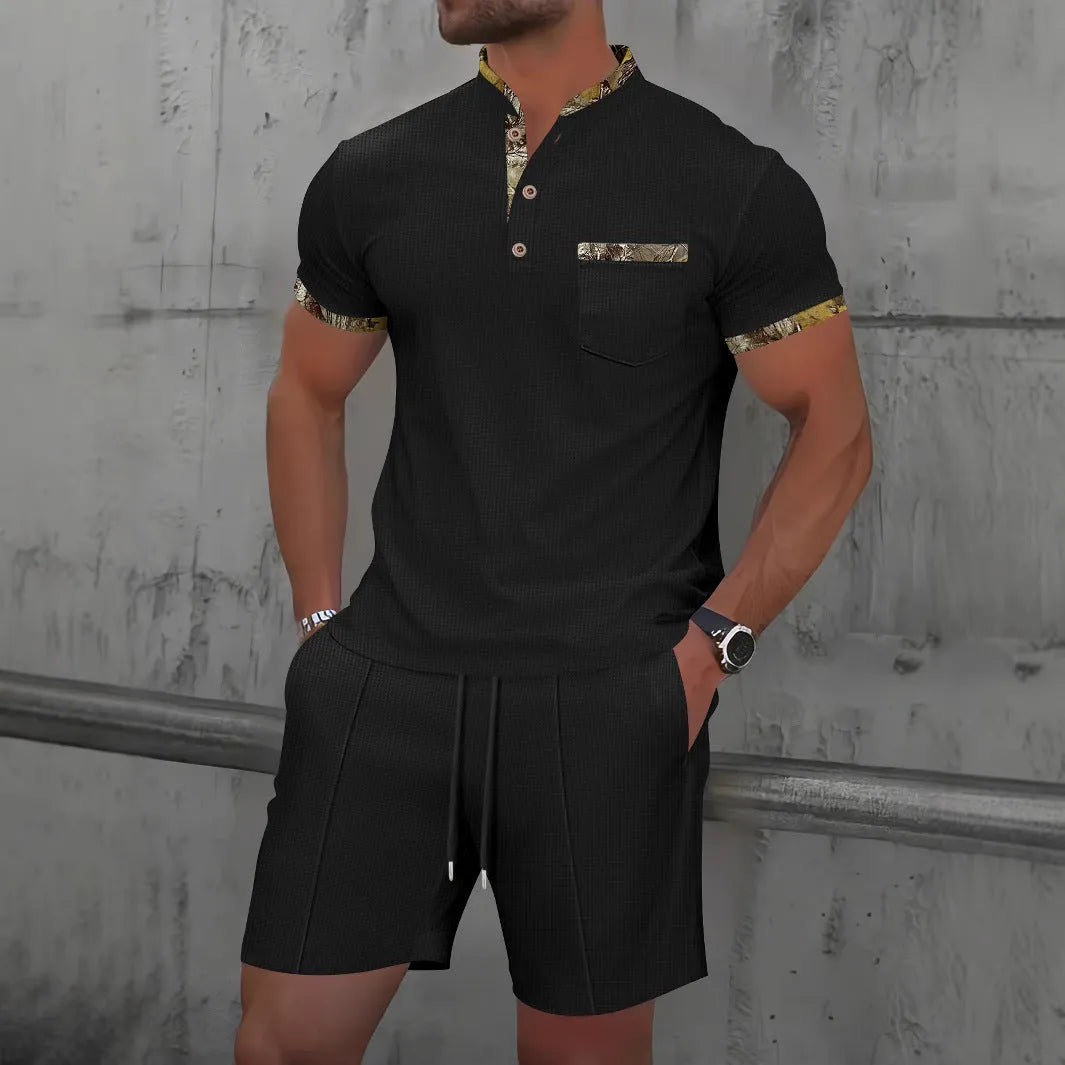Man wearing a grey waffle knit zip-up polo collar top and matching shorts from a two-piece summer suit.