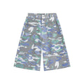Women's cropped camouflage denim cargo trousers with a pocket on the leg.