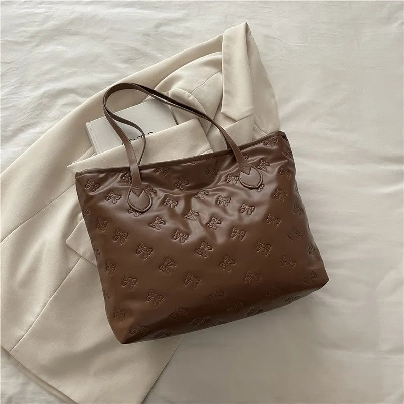French retro simple embossed PU shoulder bag in black horizontal square shape with double shoulder straps and sewing line detail