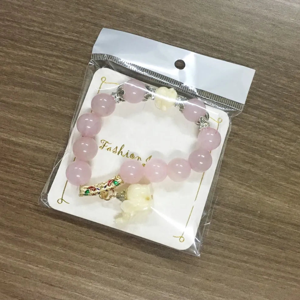 Crystal elephant charm bracelet with clear beads and gold finish metal charm