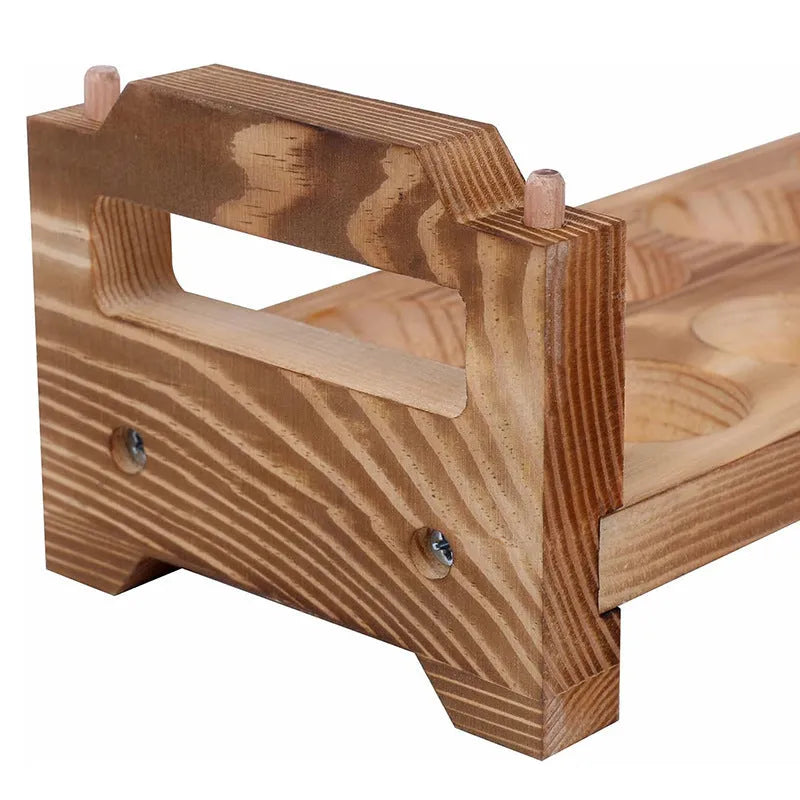 Solid wood egg storage rack in red Fire colour on a kitchen countertop
