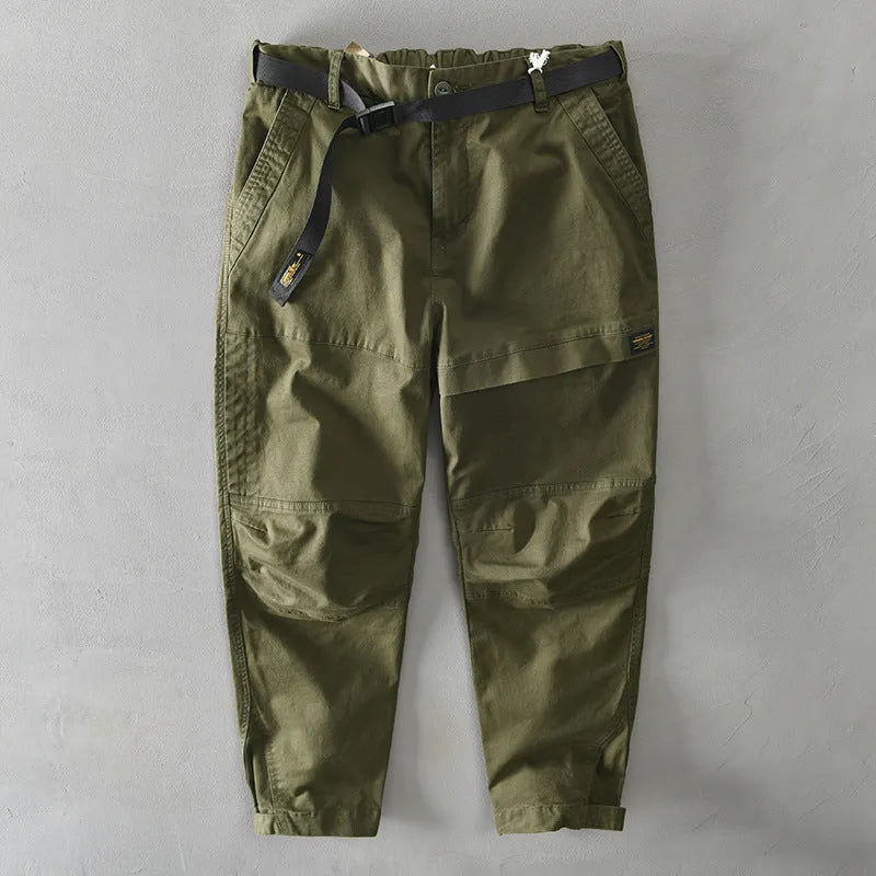 Man wearing khaki cotton elastic casual Japanese overalls with a loose fit.