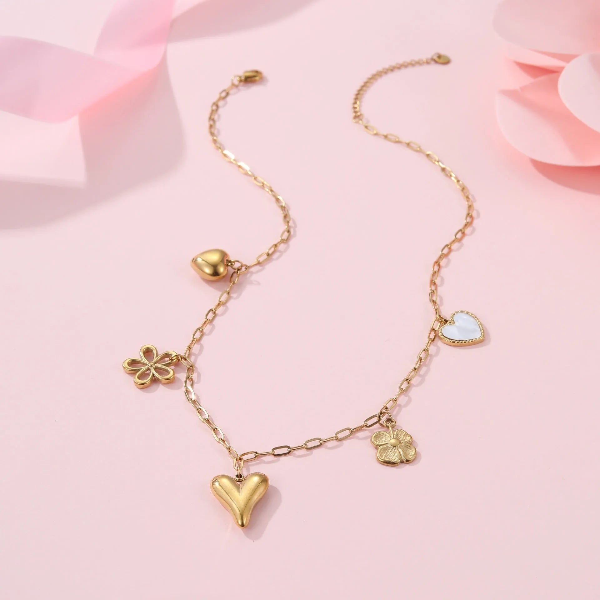 Stainless steel necklace with geometric sun pendant and 18K gold electroplated finish