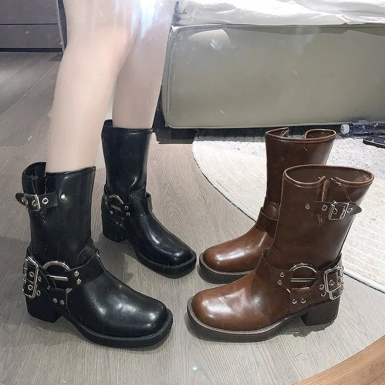 Women's black platform boots with buckle detail at calf length