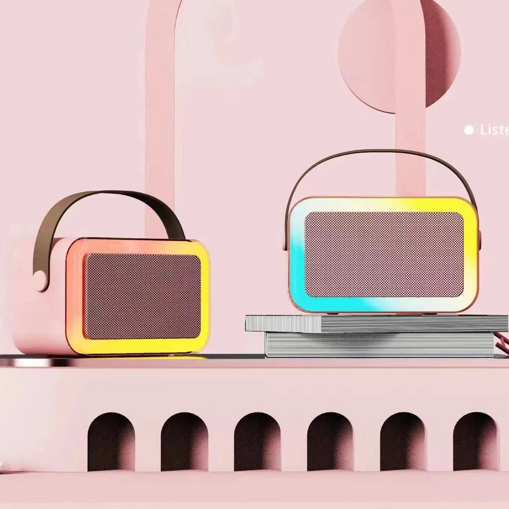 Portable coloured lights karaoke microphone and Bluetooth speaker in pink, sky blue, or white.