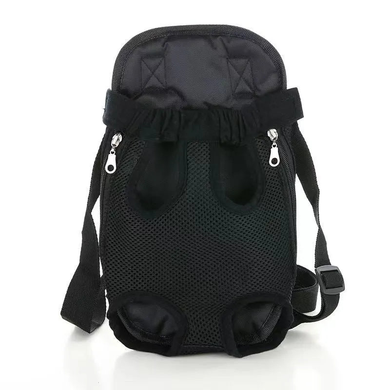 A person wearing a black dog carrier backpack containing a small dog, showing the mesh panels and adjustable straps.