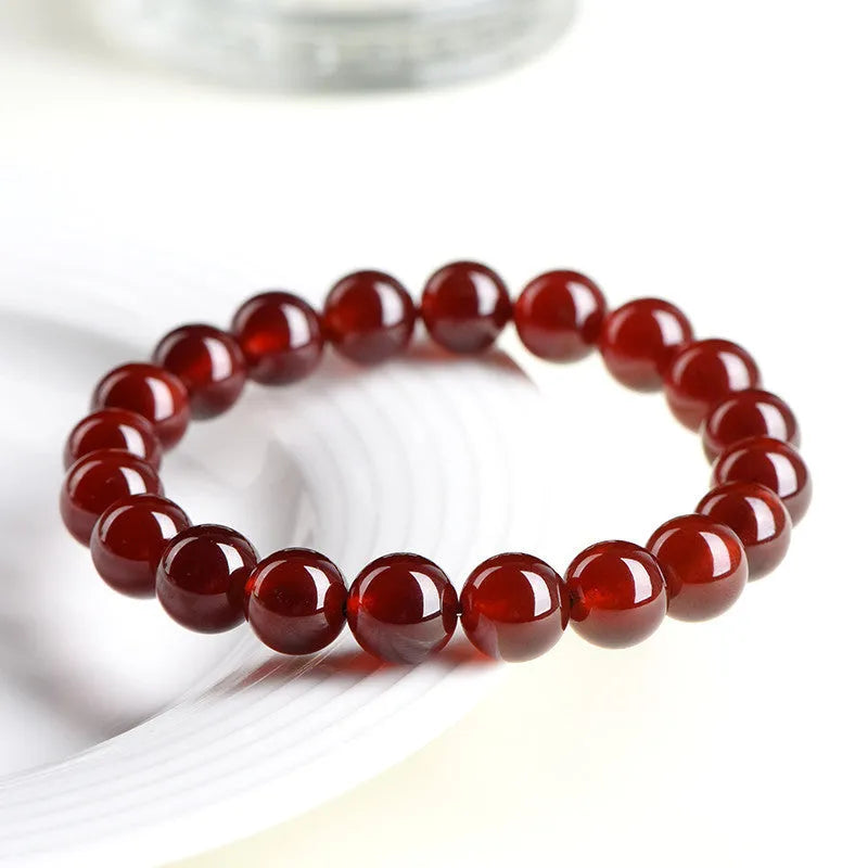 Natural orange red garnet crystal bracelet with traditional ruyi design elements in retro unisex style