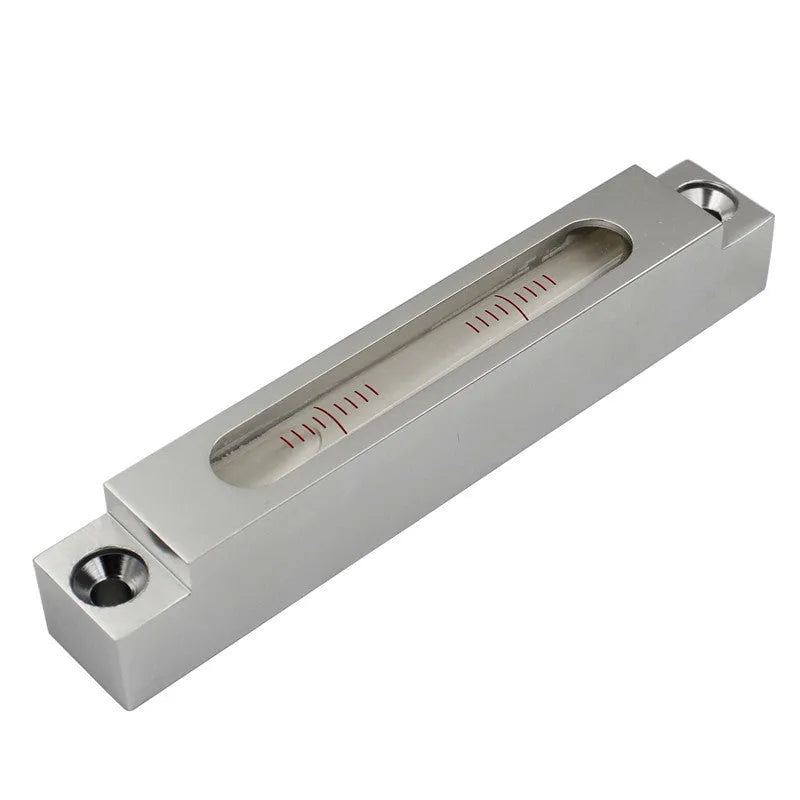 Metal and glass mini strip spirit level showing 132mm length for machine tool measurement