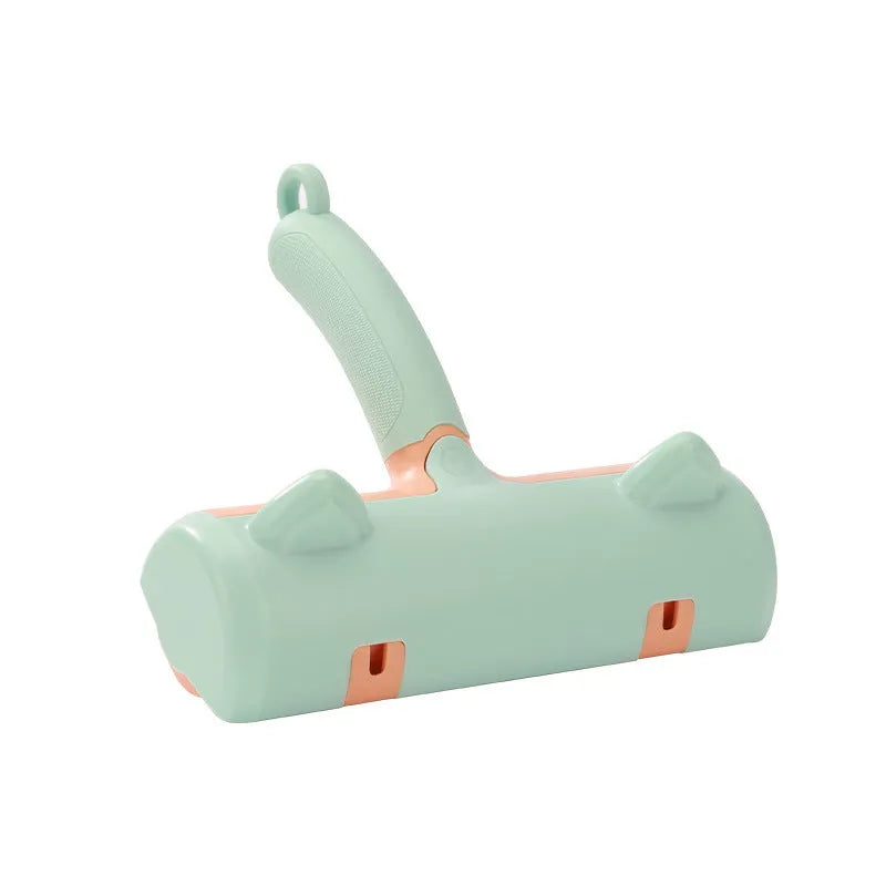 Mint green and twilight grey cat hair removal brush with two head style options on a white background.