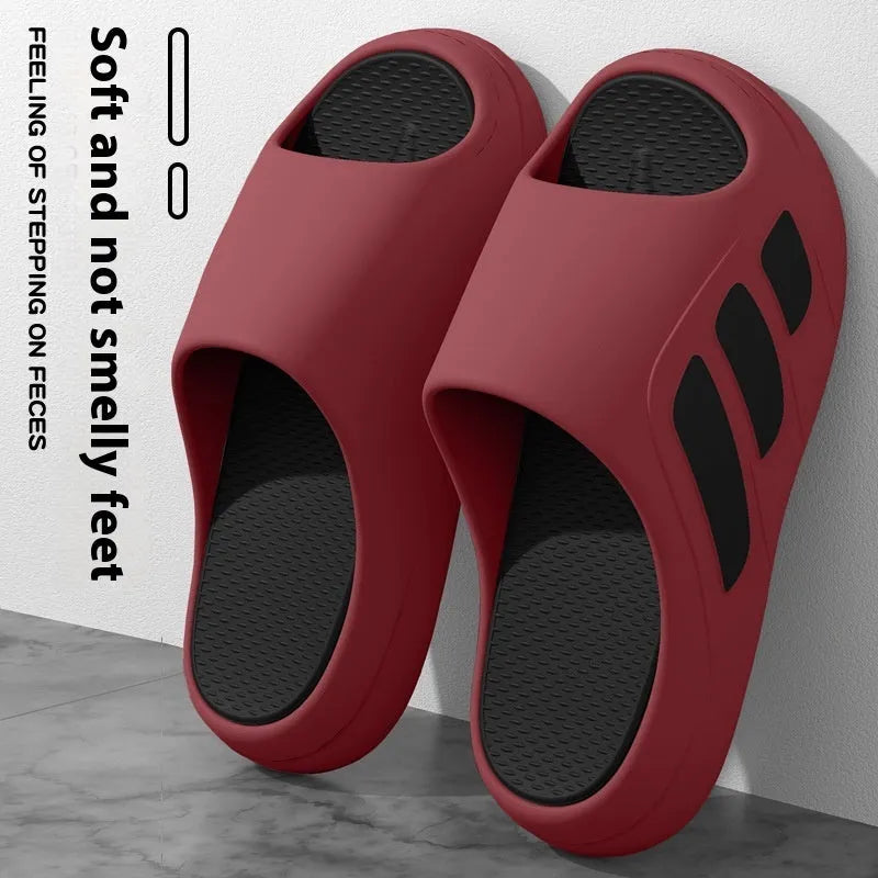 EVA platform slipper in a two-tone red and black colour with a lettered design on the upper.