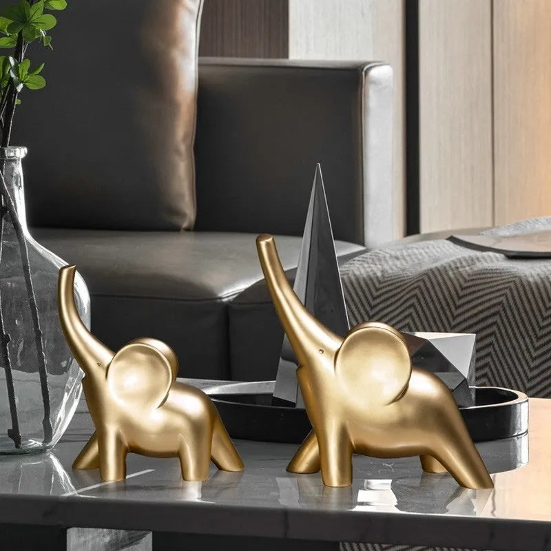 Modern minimalist elephant figurine ornament in rose gold or white resin on a plain background.