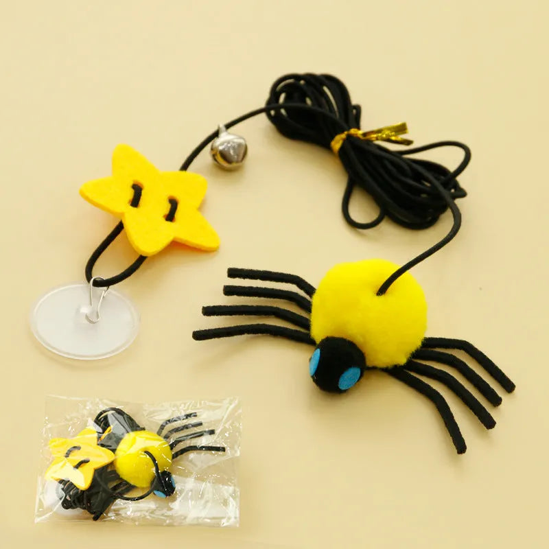 Red or yellow cat toy hanging from door with elastic rope, feathers, bells and spider attachment