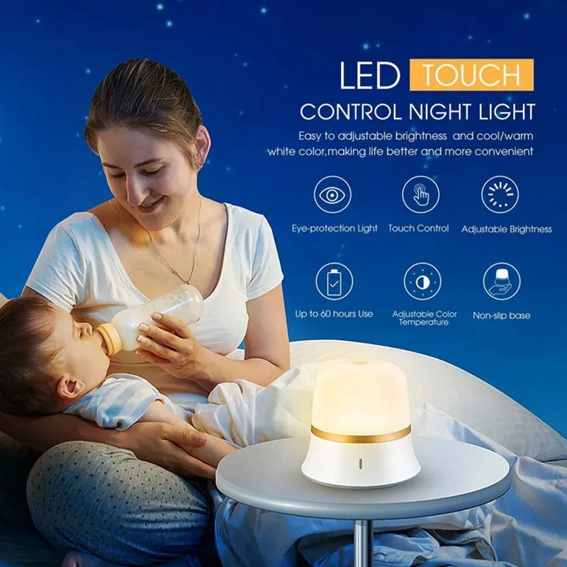 White cylindrical touch control bedside night light with USB charging cable.