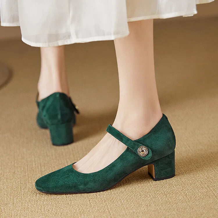 Women's black suede Mary Jane pumps with a chunky heel and square toe on a white background.