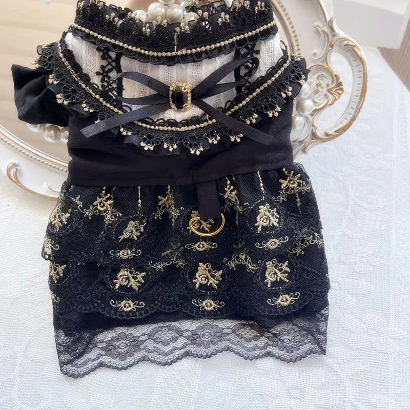 Golden gothic-style skirt for a small dog or cat on a mannequin, showing princess design.