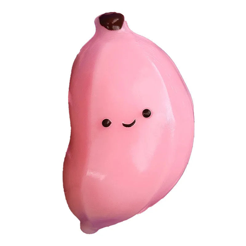 Chubby banana squeezing toy in yellow TPR shape with soft texture on plain background