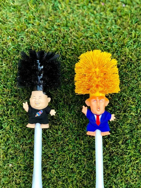 Yellow plastic Donald Trump toilet brush with 40cm length and hanging slot handle