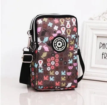 Vertical mobile phone bag in black with Oxford Spinning texture and zipper closure