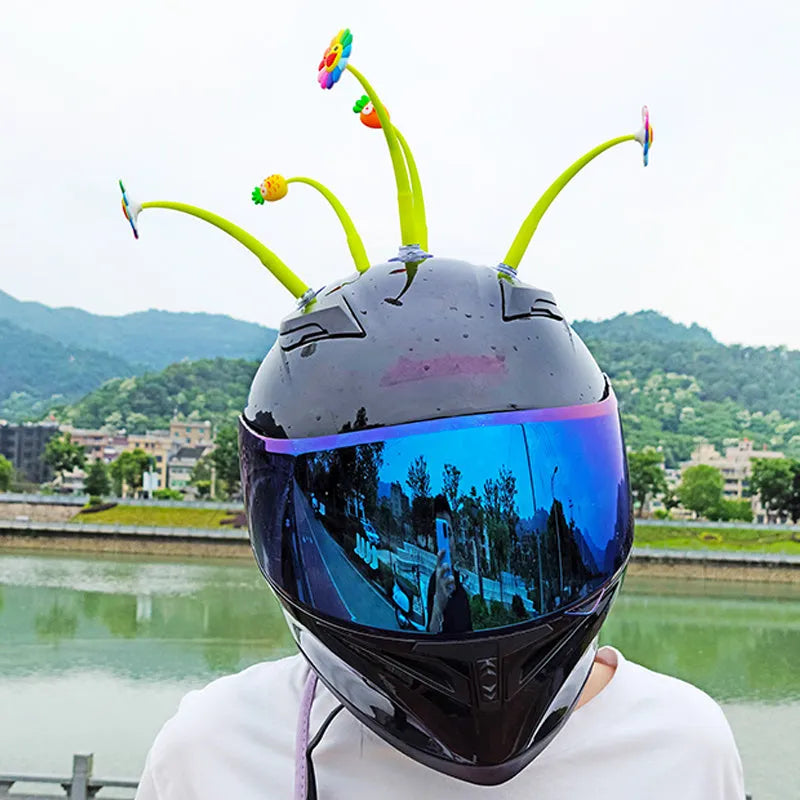 Yellow silicone sunflower decoration with suction cup base for helmets and dashboards.