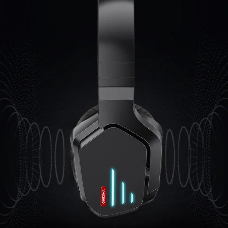 Luminous black wireless over-ear headphones with headband, shown with included 3.5mm cable and dust bag.