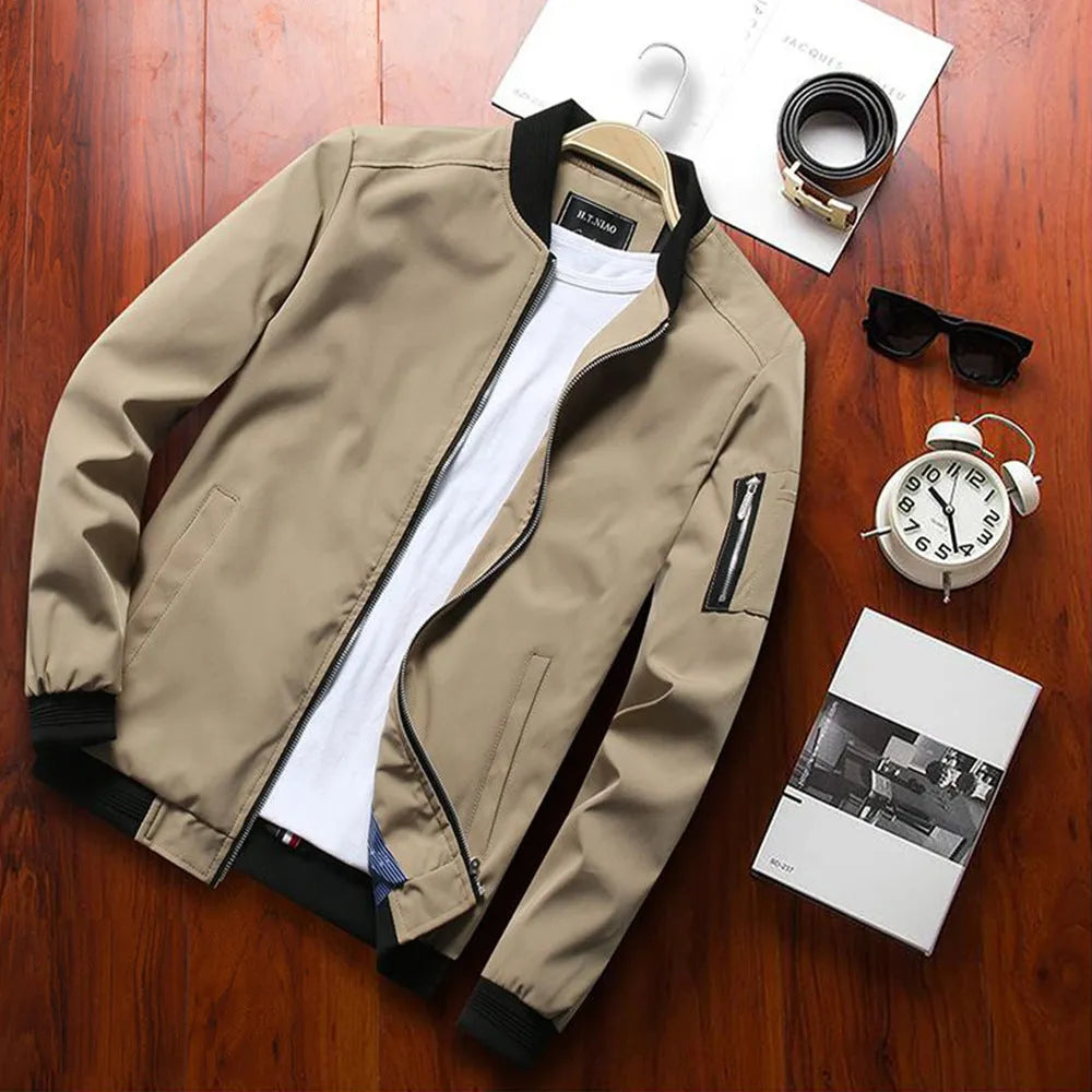 Men's slim-fit casual baseball jacket with zippered side pockets in a solid colour.