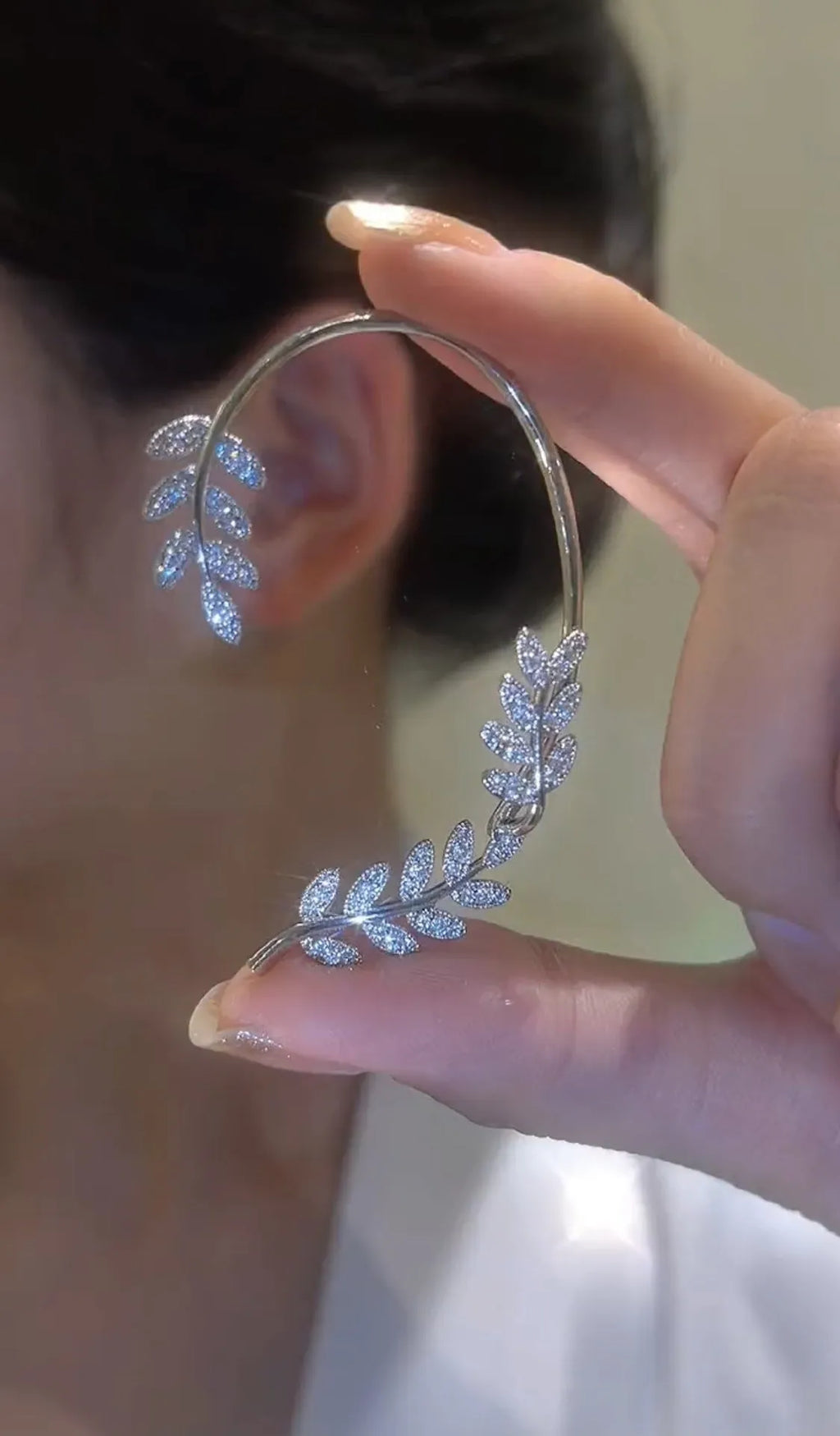 Gold detachable micro-inlaid zircon tree willow earrings pair on white background