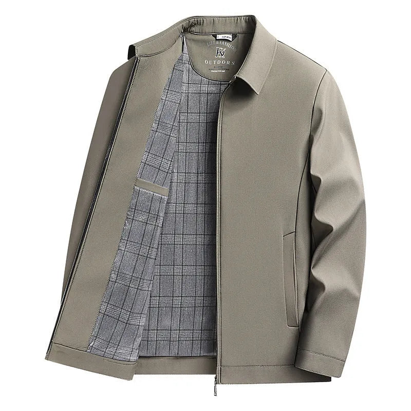 Man wearing a khaki coloured loose-fit polo collar jacket with side seam pockets.