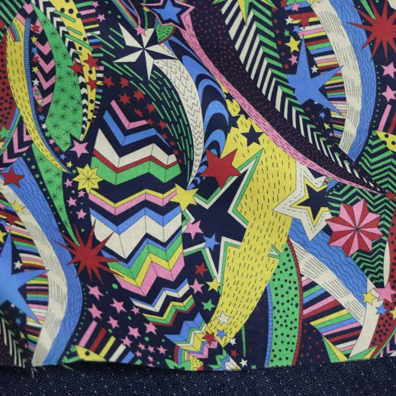 Blue digital print cotton fabric with plant and flower pattern showing 145cm width measurement