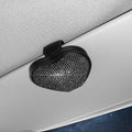Black PU leather magnetic storage clip with diamond encrustment, shown attached to a car sun visor.