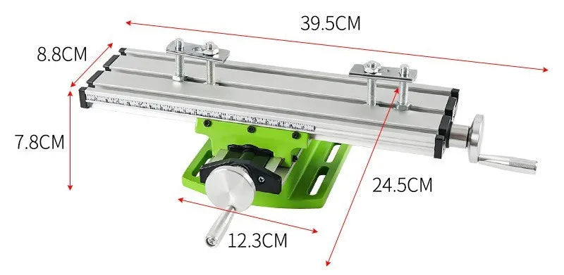 Mini bench drill and milling machine with heavy duty bench pliers on a workbench.