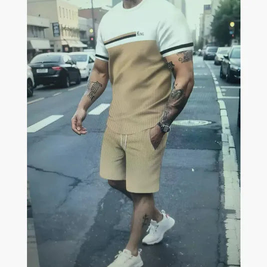 Man wearing a loose light blue short-sleeved t-shirt and matching shorts from a polyester summer set.