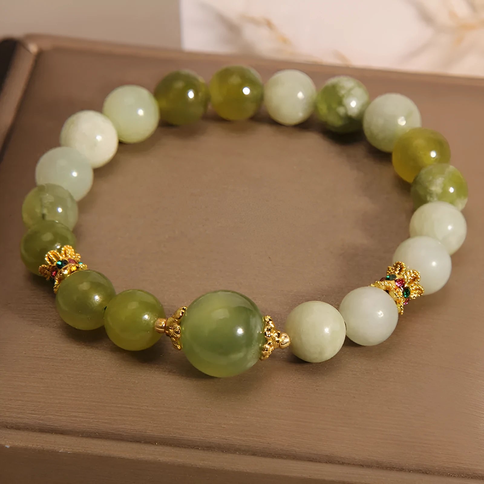 Women's original design bracelet made from green Xiuyan jade in a light luxury sweet Mori style.