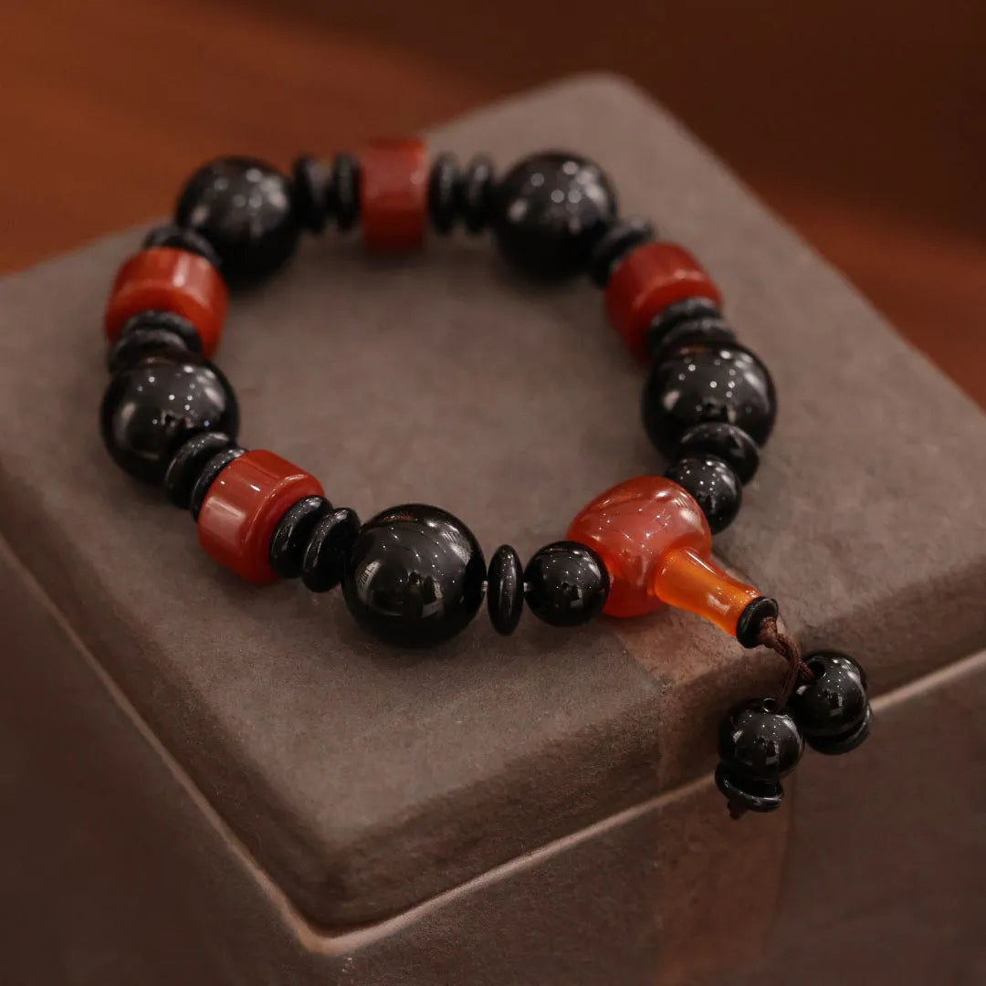 Natural agate bracelet with sardonyx, white, red, and black agate beads in geometric ethnic design